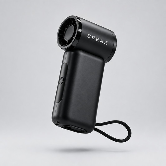 Black BREAZ ONE PRO handheld fan with powerbank, angled product view on a light grey background